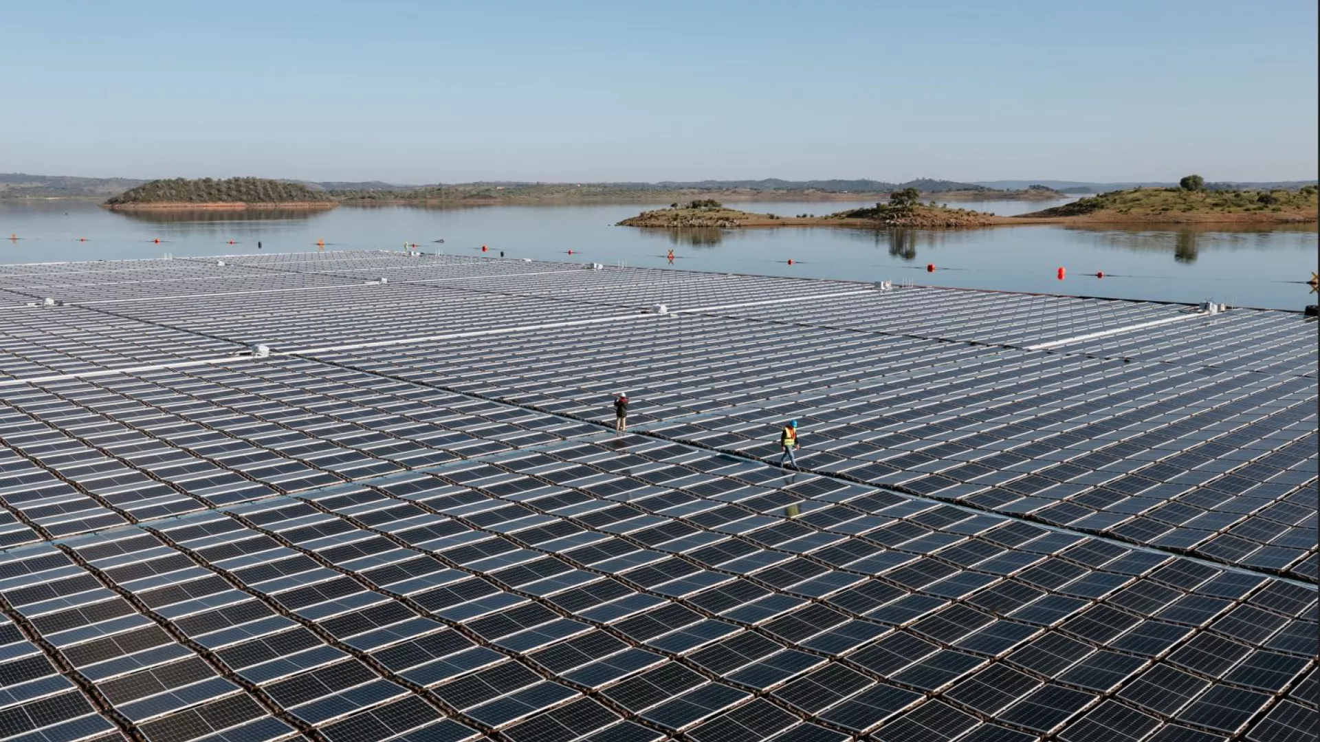 floating solar farm in alqueva, portugal, featuring over 12,000 photovoltaic panels on a reservoir